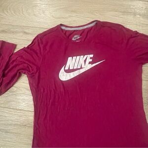 Nike maroon 2 piece set shirt comes in a size (L)  pants comes in extra large.